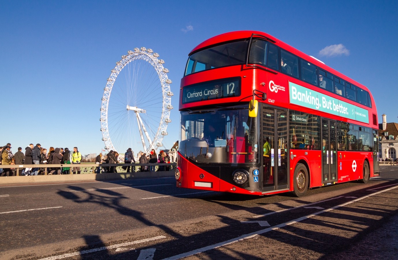 Image: Double-decker London bus on Westminster Bridge over the River Thames, Shutterstock