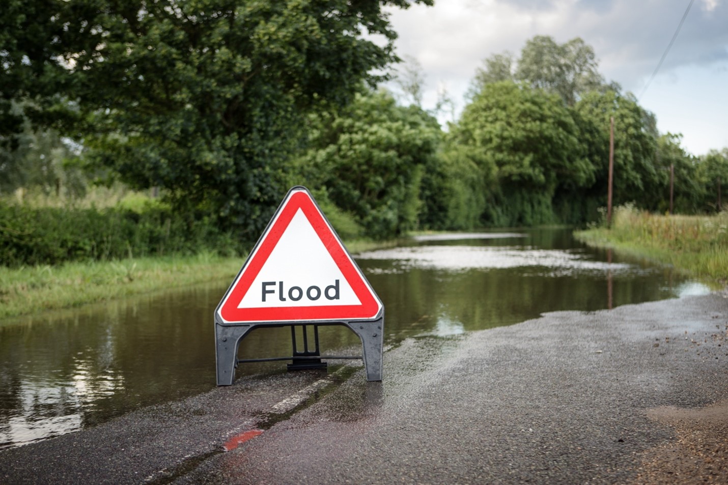Main image: flooded road in Essex, England; credit: Shutterstock